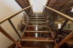 STAIRWAY LEADING TO THE UPPER LEVEL WITH BEDROOMS 3, 4 & 5